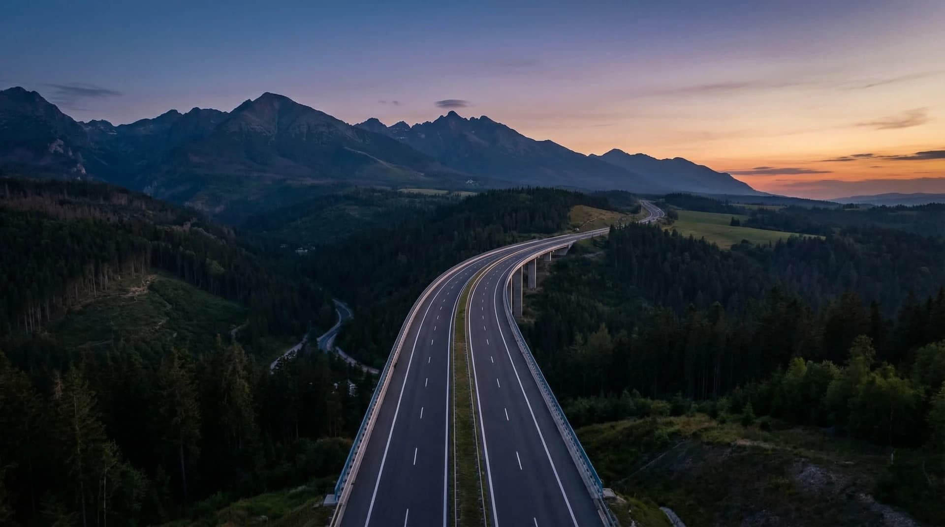 A highway with a road sign in the background.
